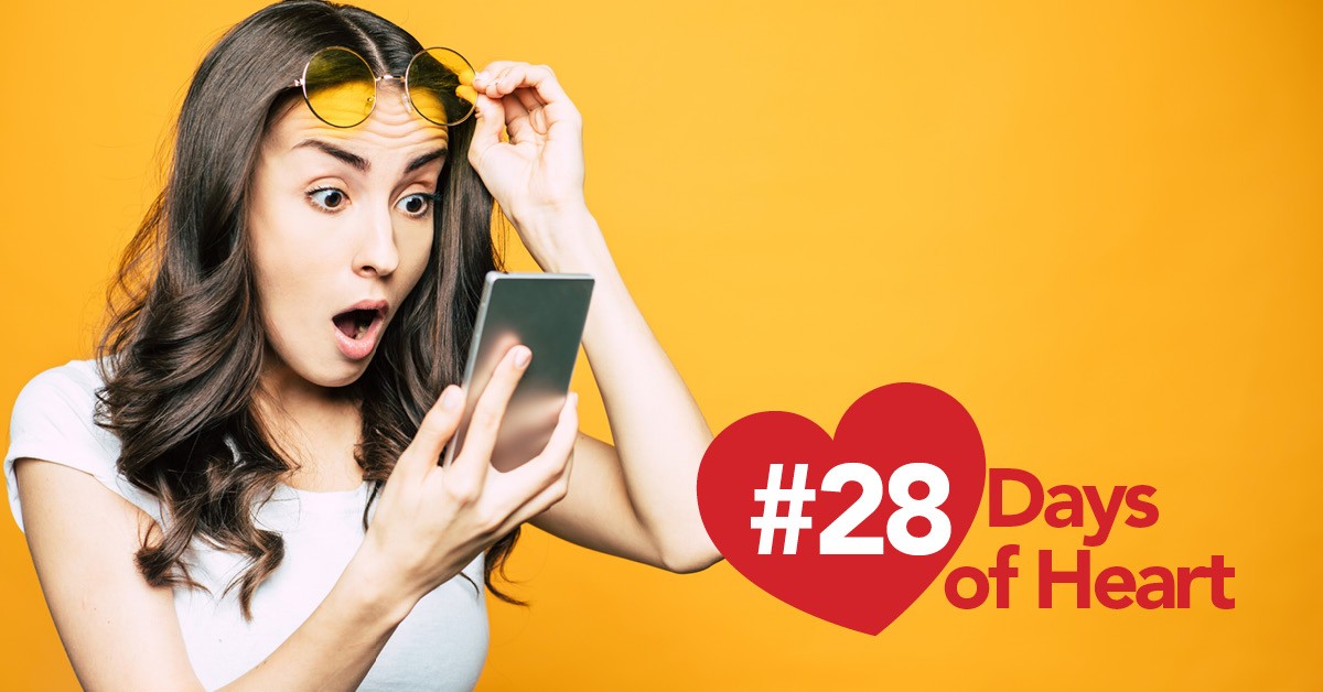 28 Days of Heart: Girl looking at phone surprised